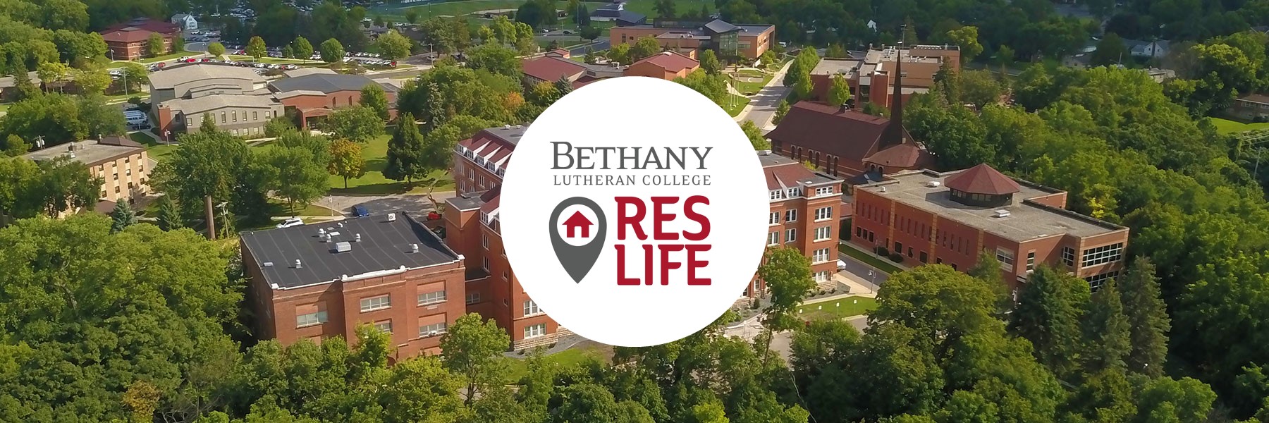 Aerial view of the Bethany Lutheran College campus in Mankato, with the Res Life logo centered.
