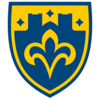 A blue and yellow shield featuring a stylized fleur-de-lis and a castle wall, symbolizing the Mankato campus community.