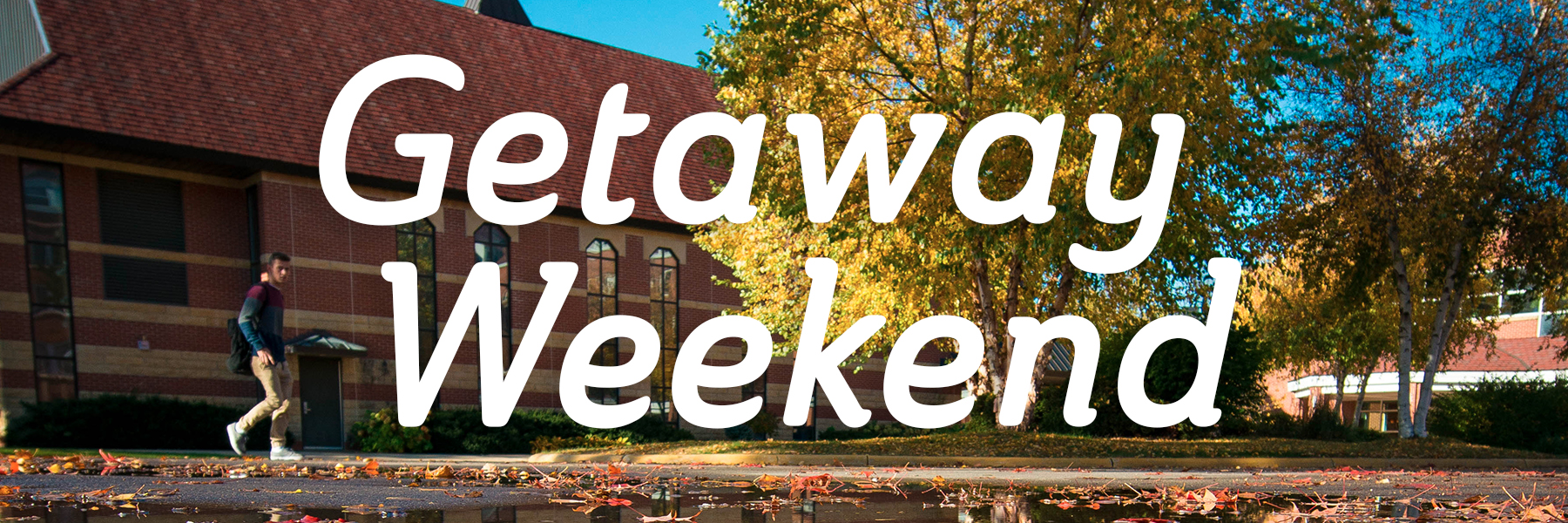 A person walks on the Bethany Lutheran College campus in Mankato, surrounded by fall trees; text reads Getaway Weekend.