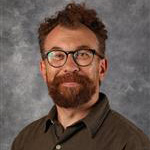 Jason Jaspersen, Associate Professor for the Studio Art Department, set on a gray background.
