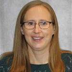 Kelly Holtz, Adjunct Faculty for the Nursing Department, in front of a plain light background.
