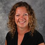 Kristi Ringen, Academic Resource Center Coordinator for the Academic Affairs Department, set on a gray textured background.