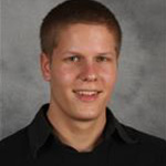 Matt Bartels, Technician for the Maintenance Department, against a gray background.