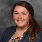 Meagan Bixby, Adjunct Faculty for the Nursing Department, against grey background.