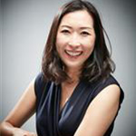 Seonhwa Lee, Adjunct Faculty for the Clinical Mental Health Counseling – Graduate Programs Department, poses against a gray background.
