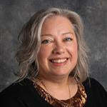 Stephanie Schmid, Admissions Processing for the Admissions Department, against a grey background.