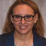 Sue Beavis, Adjunct Faculty for the Nursing Department, against a grey background.