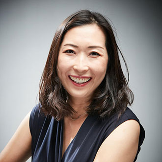 Seonhwa Lee, Adjunct Faculty for the Clinical Mental Health Counseling - Graduate Programs Department, is posed against a grey background.