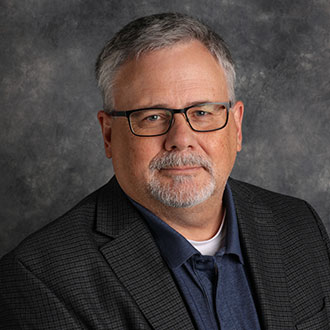 Tom Rank, Associate Professor for the Religion Department, posing for a portrait.